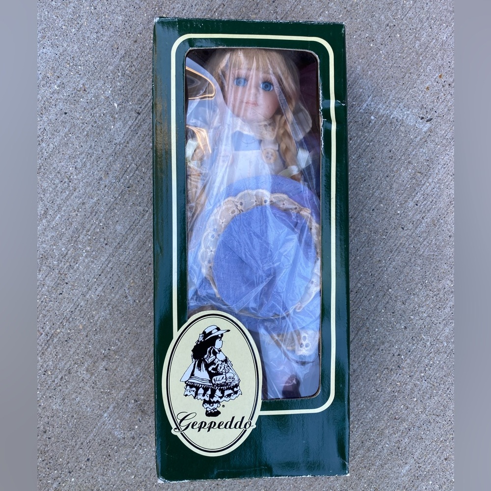 Geppeddo Porcelain Blue and Cream Doll with Hat